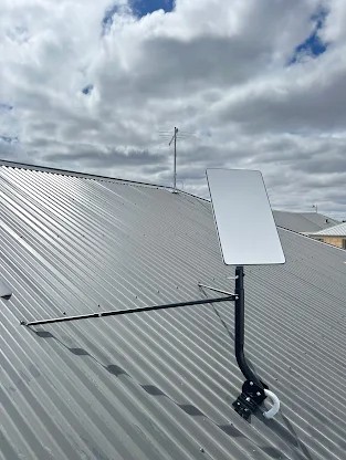 Starlink and TV antenna installation on roof