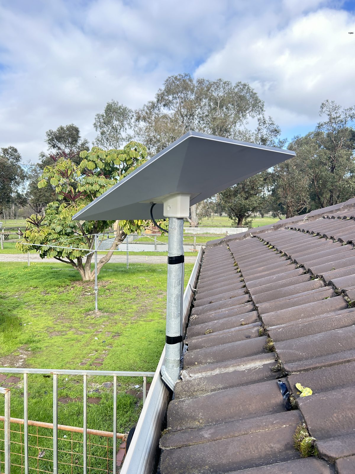 Starlink dish mounted on tile roof