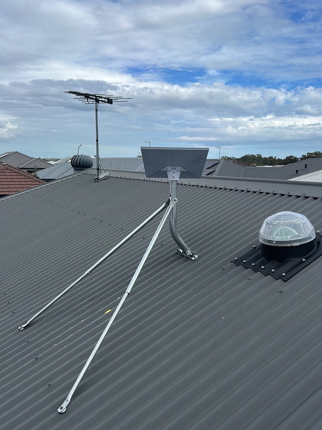 Starlink dish installation on tin roof — rear view