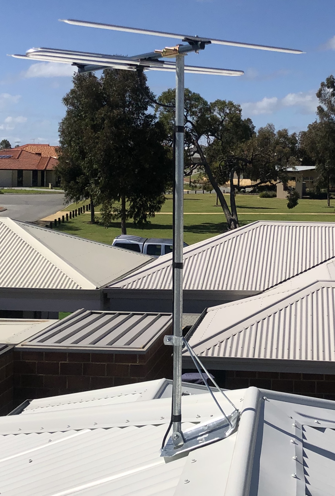 Professional electrical and antenna work on tin roof